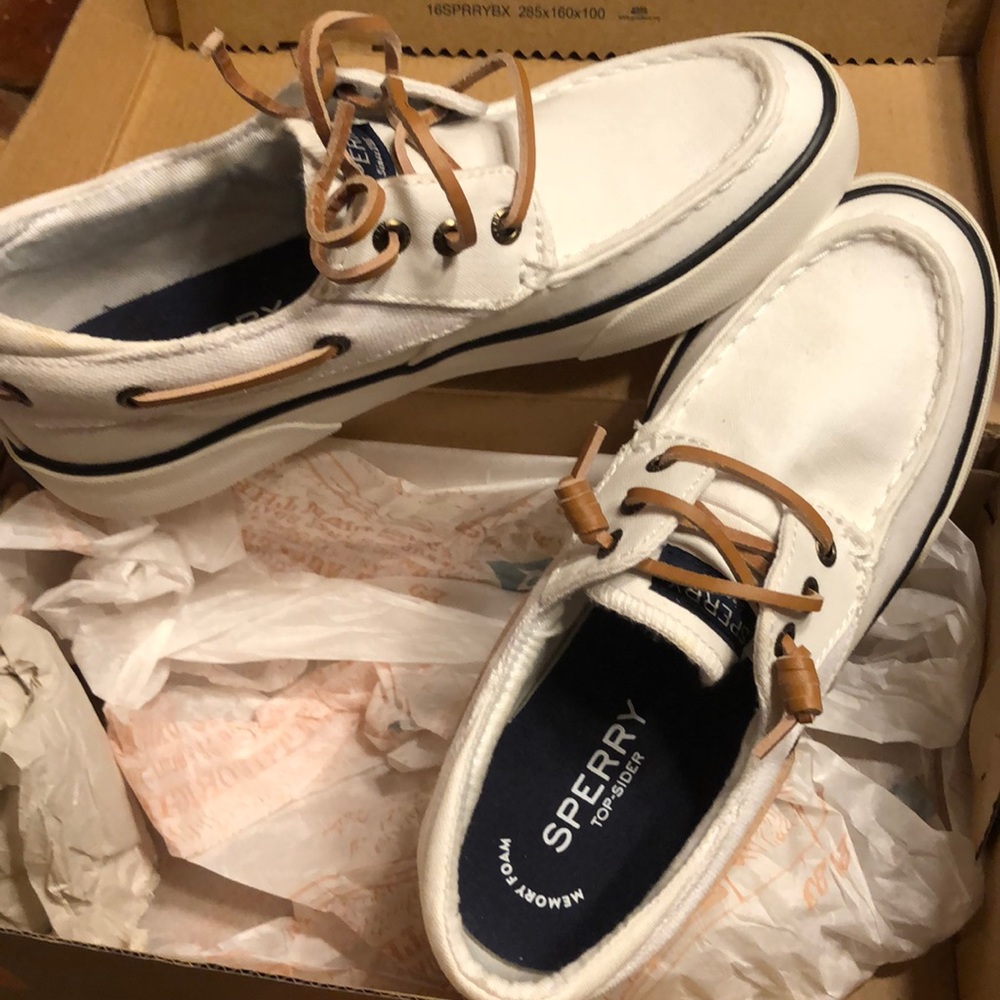 White canvas women’s Sperry’s Top-Siders.